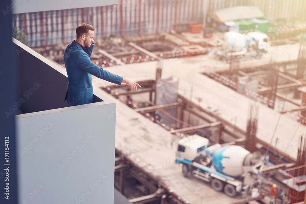 Fototapeta premium Professional senior construction engineer giving instructions