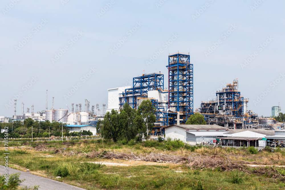 Refinery tower in petrochemical industrial plant with blue sky Refinery tower in petrochemical industrial plant with blue sky