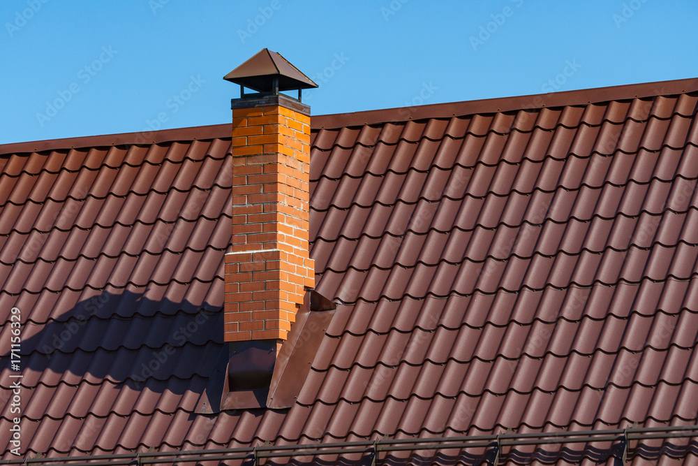 Naklejka premium brick chimney pipe at home