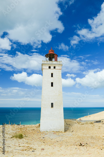 Lighthouse Rubjerg Knude and sand dunes at the danish North Sea coast, vintage style, Denmark, Europe