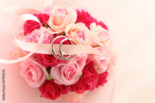 artificial rose bouquet and wedding ring