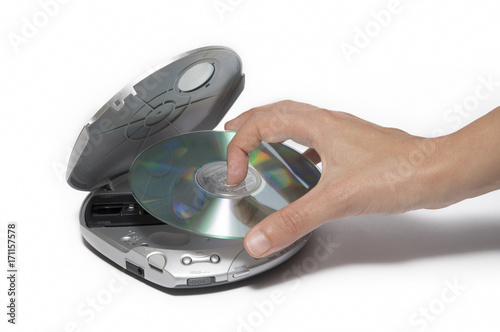 Placing Cd Inside Portable Cd Player photo