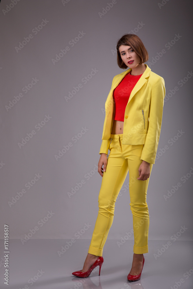 Glamour fashion style catalog casual clothes for business woman meeting date walk party sexy beautiful woman brunette shot hair wear yellow costume perfect body shape model suit Glamour fashion style catalog casual clothes for business woman meeting date walk party sexy beautiful woman brunette shot hair wear yellow costume perfect body shape model suit
