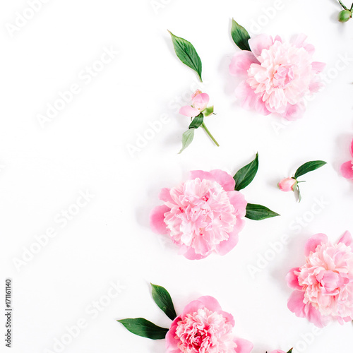 Flower pattern of pink peony flowers  branches  leaves and petals on white background. Flat lay  top view. Peony flower texture.