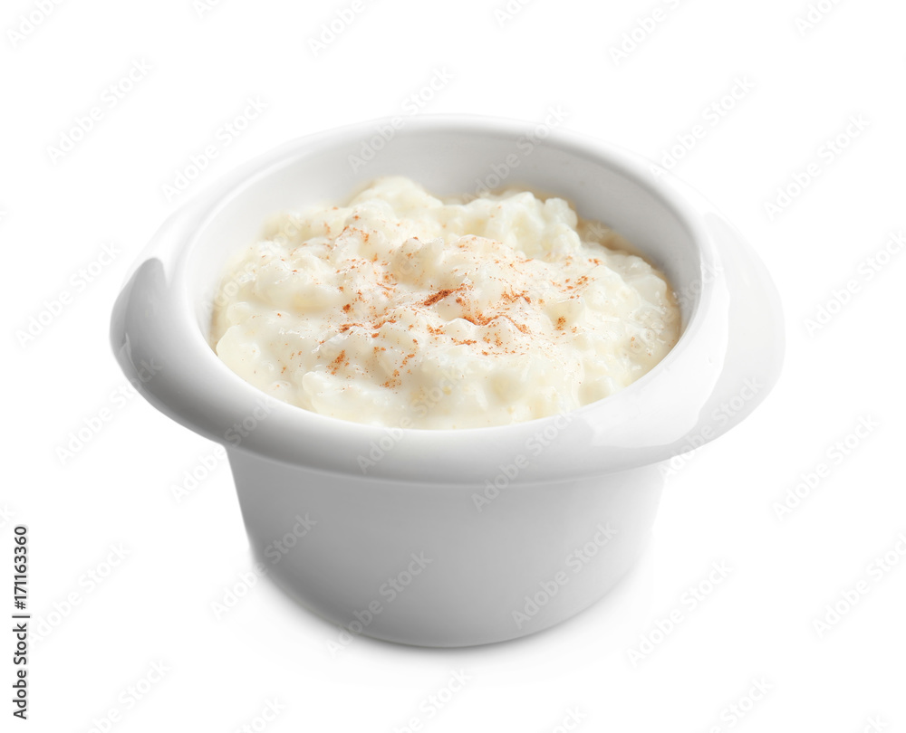 Creamy rice pudding with cinnamon powder in bowl on white background Creamy rice pudding with cinnamon powder in bowl on white background