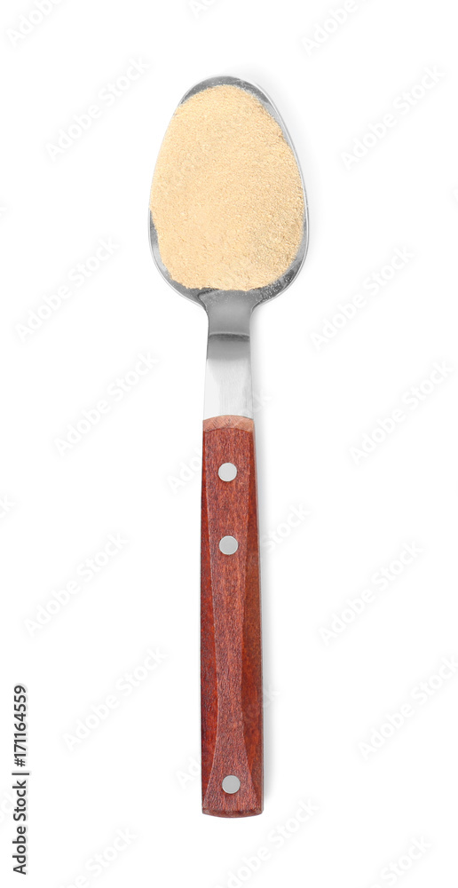 Spoon with maca root powder on white background Spoon with maca root powder on white background