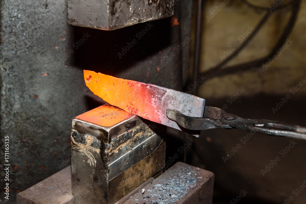 Forging molten metal. Making knives. Forging molten metal. Making knives.
