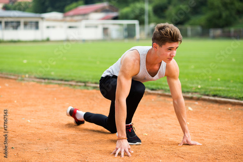 Young caucasian boy training outdoor. Sport and muscle concept © Novak