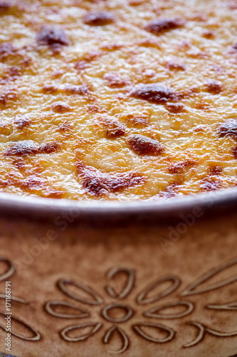 Pastitsio Traditional Greek Baked Pasta Casserole With Ground Beef, Tomatoes, Feta Cheese and Bechamel Sauce photo