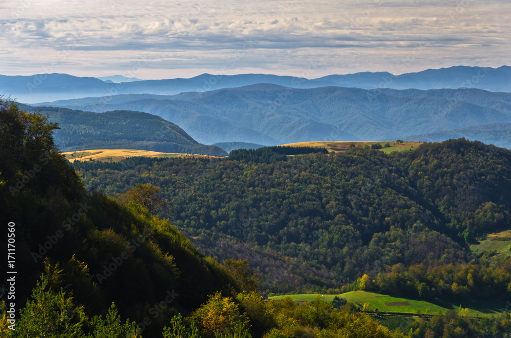 Fototapeta premium Viewpoint on a landscape of mount Bobija, hills, meadows and colorful forests, west Serbia