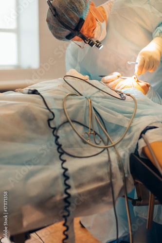 Portrait of a confident surgeon at work photo