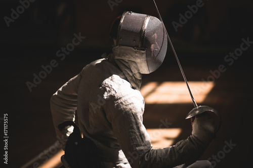 portrait of a disabled fencers during training in hall photo