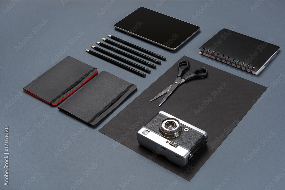 Set of black office stationery on a gray background, flat lay Set of black office stationery on a gray background, flat lay