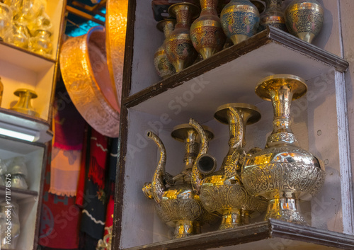 Brass jars, pitchers and other utensils at the Thamel marketplace, Kathmandu, Nepal photo