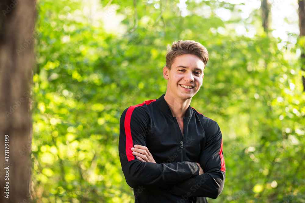 Young handsome blonde guy training outdoor and smiling Young handsome blonde guy training outdoor and smiling