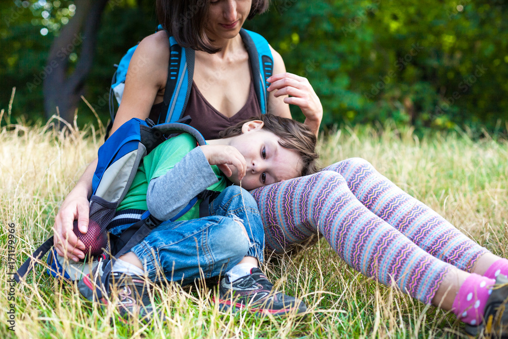 Fototapeta premium child is resting by the mother in her arms