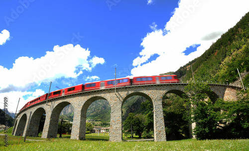 Bild auf Leinwand Bernina Express Train at Brusio on the Swiss alps