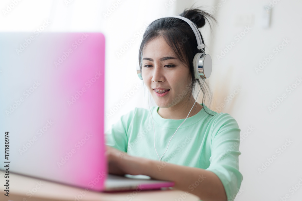 Young Asian woman using laptop computer Young Asian woman using laptop computer