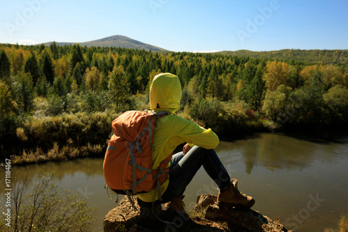 hiking woman enjoy the view in the autumn forest