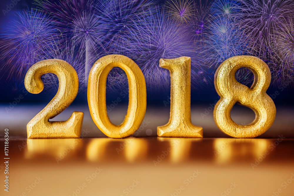 Golden Number 2018 placed on gold elegant glamour night tone background with celebration firework for new year 2018 concept