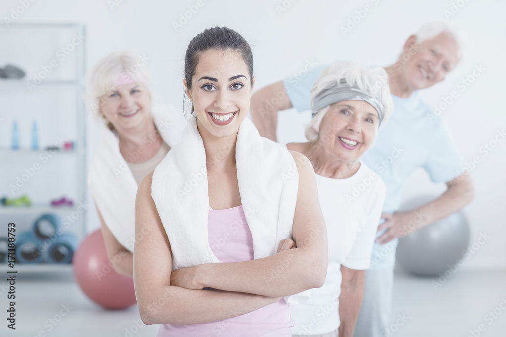 Fototapeta premium Smiling trainer and elderly people