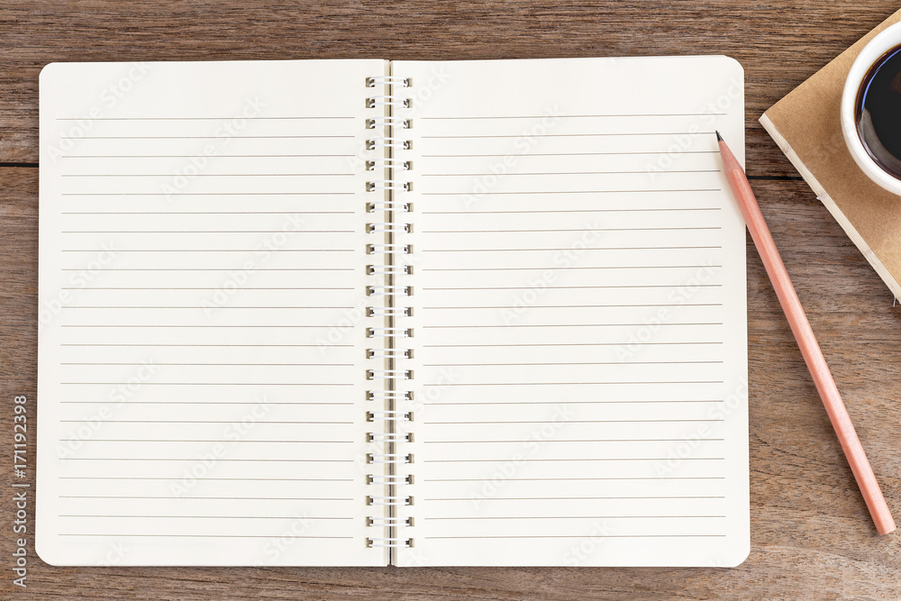 blank notebook with coffee cup on wooden background. blank notebook with coffee cup on wooden background.