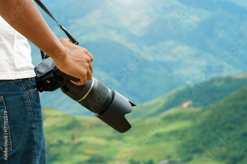 Tablou pe pânză photographer taking camera for adventure travel in natural view