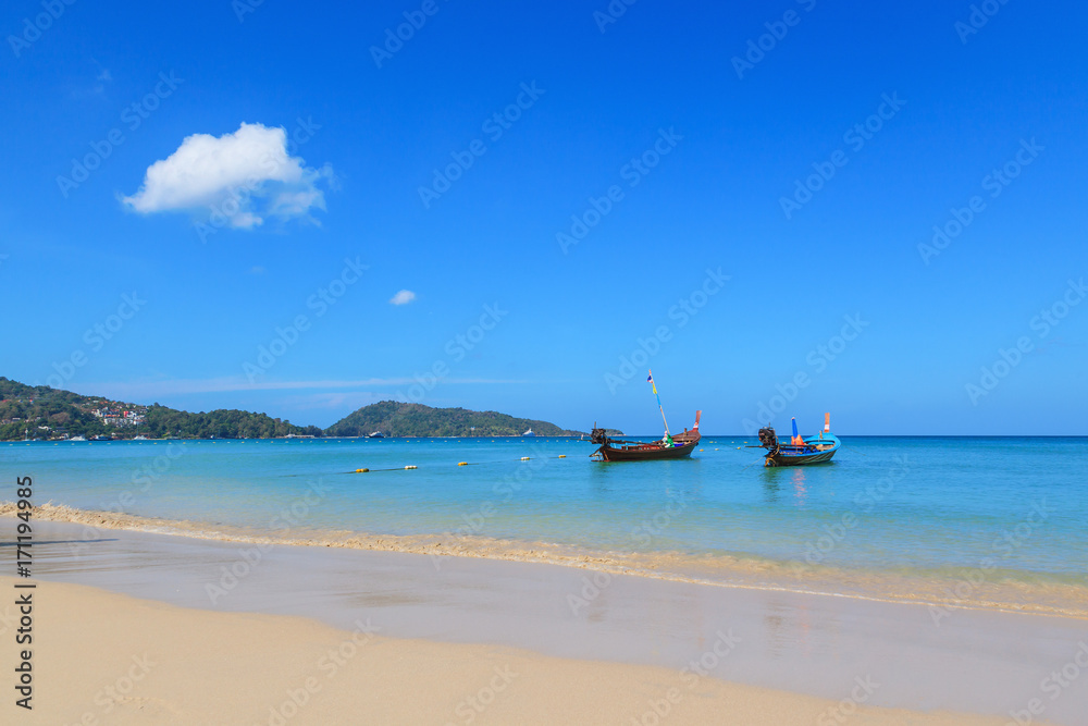 Landscape of long tail boats on Karon and Kata Beaches with blue sky background at Phuket, Thailand. Landscape of long tail boats on Karon and Kata Beaches with blue sky background at Phuket, Thailand.