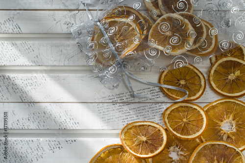 dried slice of orange over white background photo