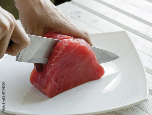 Fotografija Yellow Fin Tuna being cut up for cooking. Tuna Fish.