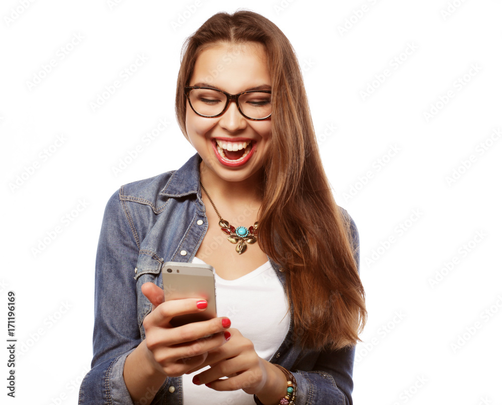 Cheerful woman talking on the phone isolated on a white backgrou Cheerful woman talking on the phone isolated on a white backgrou
