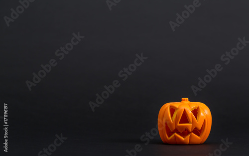 Halloween pumpkin decorations on a black background © Tierney