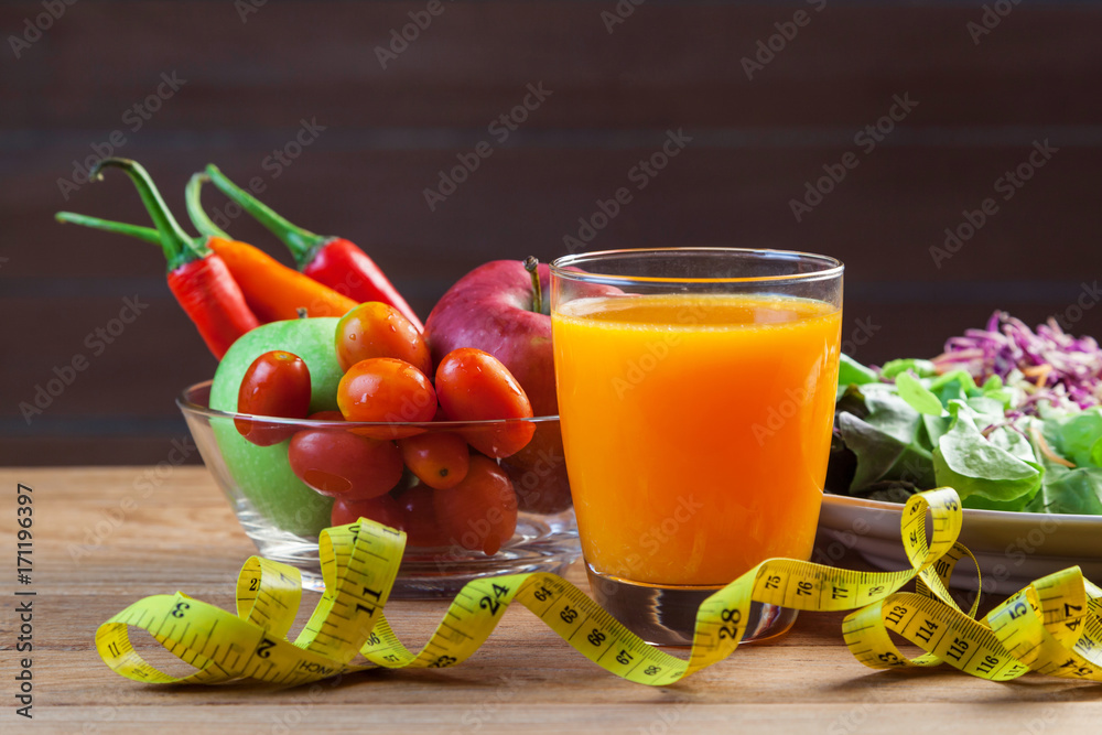 Fresh healthy salad with different fruits and vegetables on wooden background Fresh healthy salad with different fruits and vegetables on wooden background