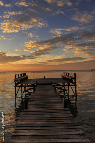 sunrise in the morning with wooden bridge