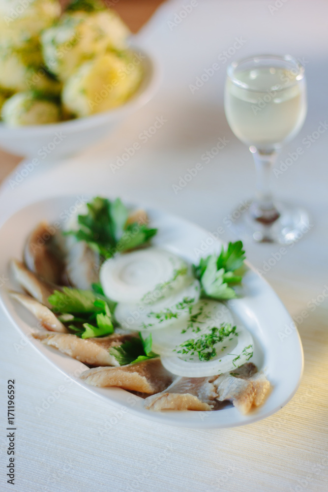 Salty herring on restaurant table.