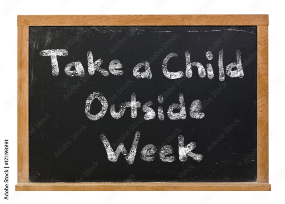 Obraz premium Take a child outside week written in white chalk on a black chalkboard isolated on white
