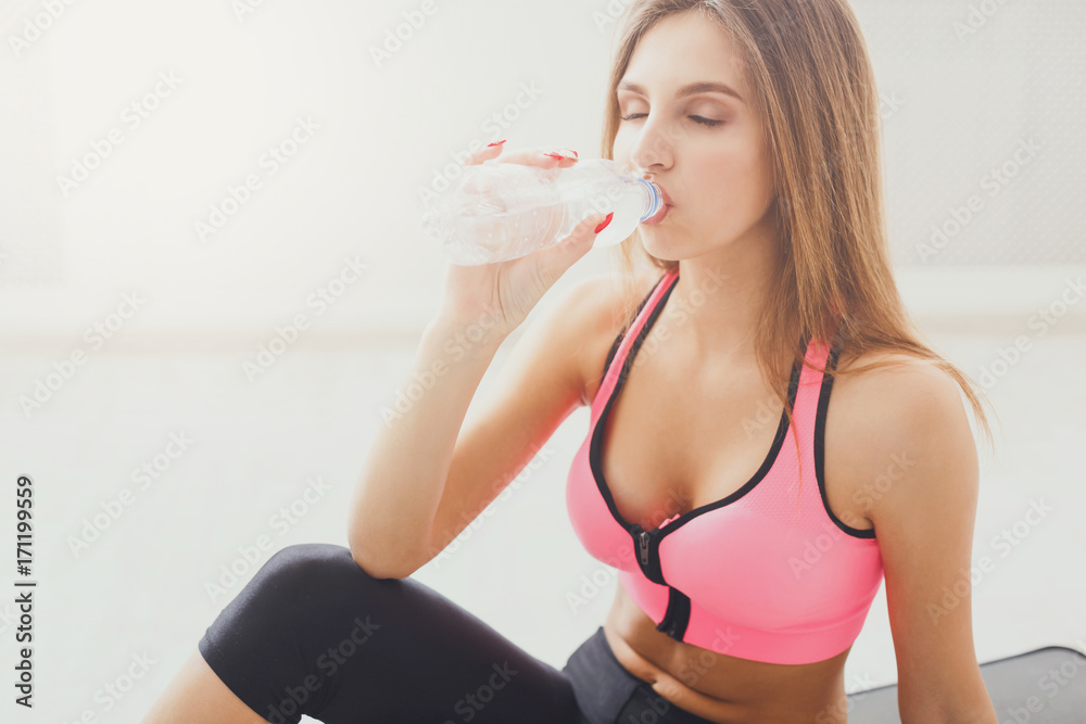Beautiful young sport woman drinking water Beautiful young sport woman drinking water