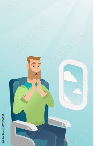 Young caucasian man shocked by plane flight in the turbulent area. Frightened airplane passenger sitting in airplane seat and suffering from aerophobia. Vector cartoon illustration. Vertical layout.