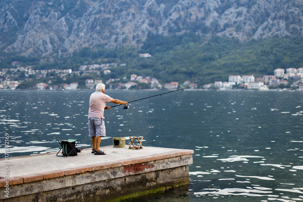 The old man fishes in the sea
