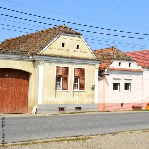 Typical rural landscape and peasant houses in  the village Cata, Transylvania, Romania. The settlement was founded by the Saxon colonists in the middle of the 12th century