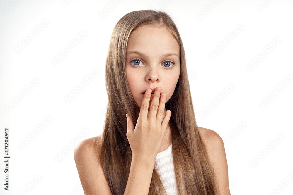 little girl covers her face with her hand with long straight hair, portrait little girl covers her face with her hand with long straight hair, portrait