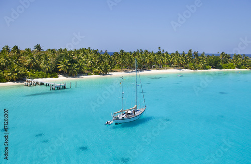 sailing Vessel in the shallow waters of Cocos Keeling Atoll, Indian Ocean photo