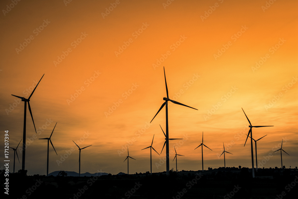 Wind generators turbines at sunset. Beautiful mountain landscape with wind generators turbines at Huai Bong,Dan Khun Thot ,Thailand. Renewable energy concept. Wind generators turbines at sunset. Beautiful mountain landscape with wind generators turbines at Huai Bong,Dan Khun Thot ,Thailand. Renewable energy concept.