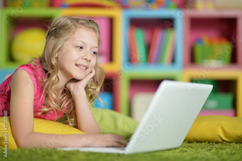 Cute little girl with laptop 