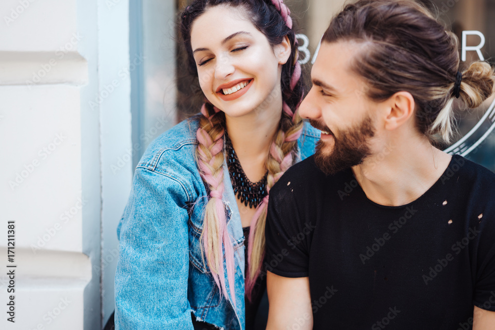 Fototapeta premium Young man and woman on the stree
