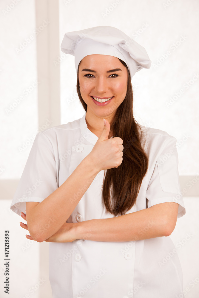 young blonde chef woamn holds kitchenware as she prepares to cook a meal isolated over white background young blonde chef woamn holds kitchenware as she prepares to cook a meal isolated over white background
