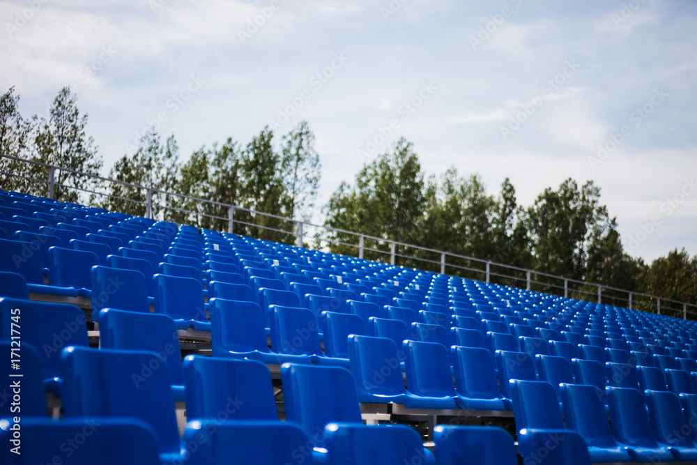 Naklejka premium blue tribunes at the local stadium