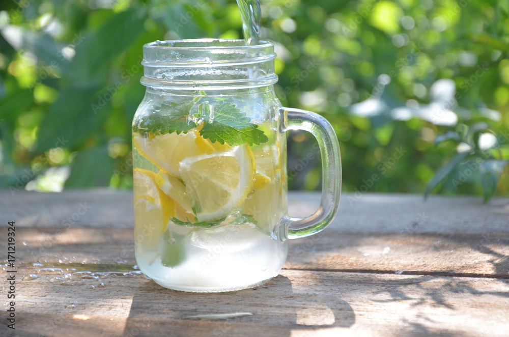 Lemon mojito cocktail with mint lemonade, cold refreshing drink or beverage, ice Lemon mojito cocktail with mint lemonade, cold refreshing drink or beverage, ice