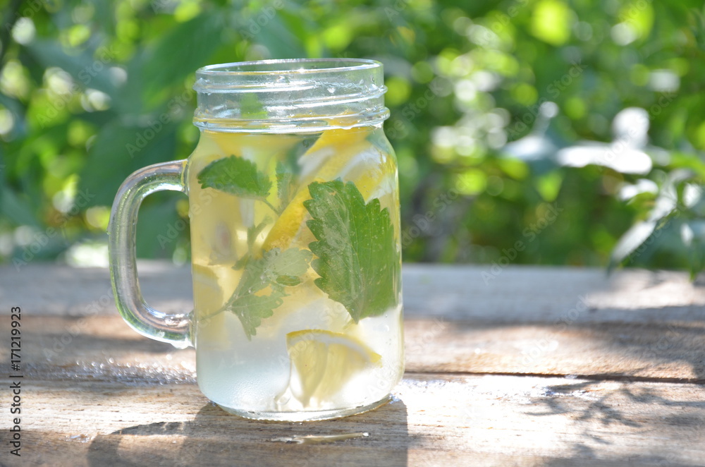 Lemon mojito cocktail with mint lemonade, cold refreshing drink or beverage, ice Lemon mojito cocktail with mint lemonade, cold refreshing drink or beverage, ice