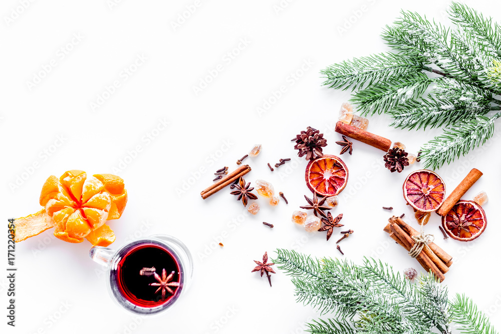 Ingredients mulled wine or grog with spices and citrus for winter evening. Christmas new year eve. White background top view. Space for text Ingredients mulled wine or grog with spices and citrus for winter evening. Christmas new year eve. White background top view. Space for text